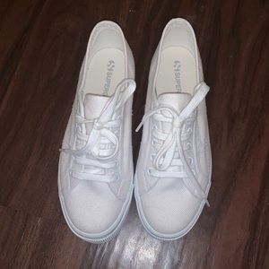 All white Superga sneakers